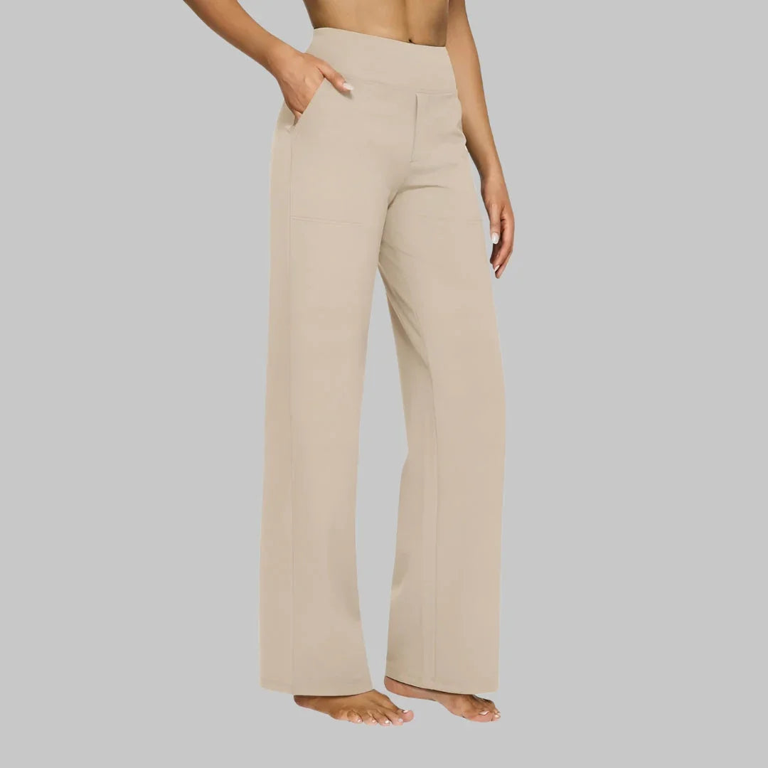 Cream wide-leg pants with high-rise waist and side pockets, relaxed straight legs.