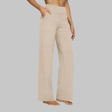 Cream wide-leg pants with high-rise waist and side pockets, relaxed straight legs.