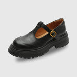 Black T-bar leather shoes with gold buckle and chunky treaded sole