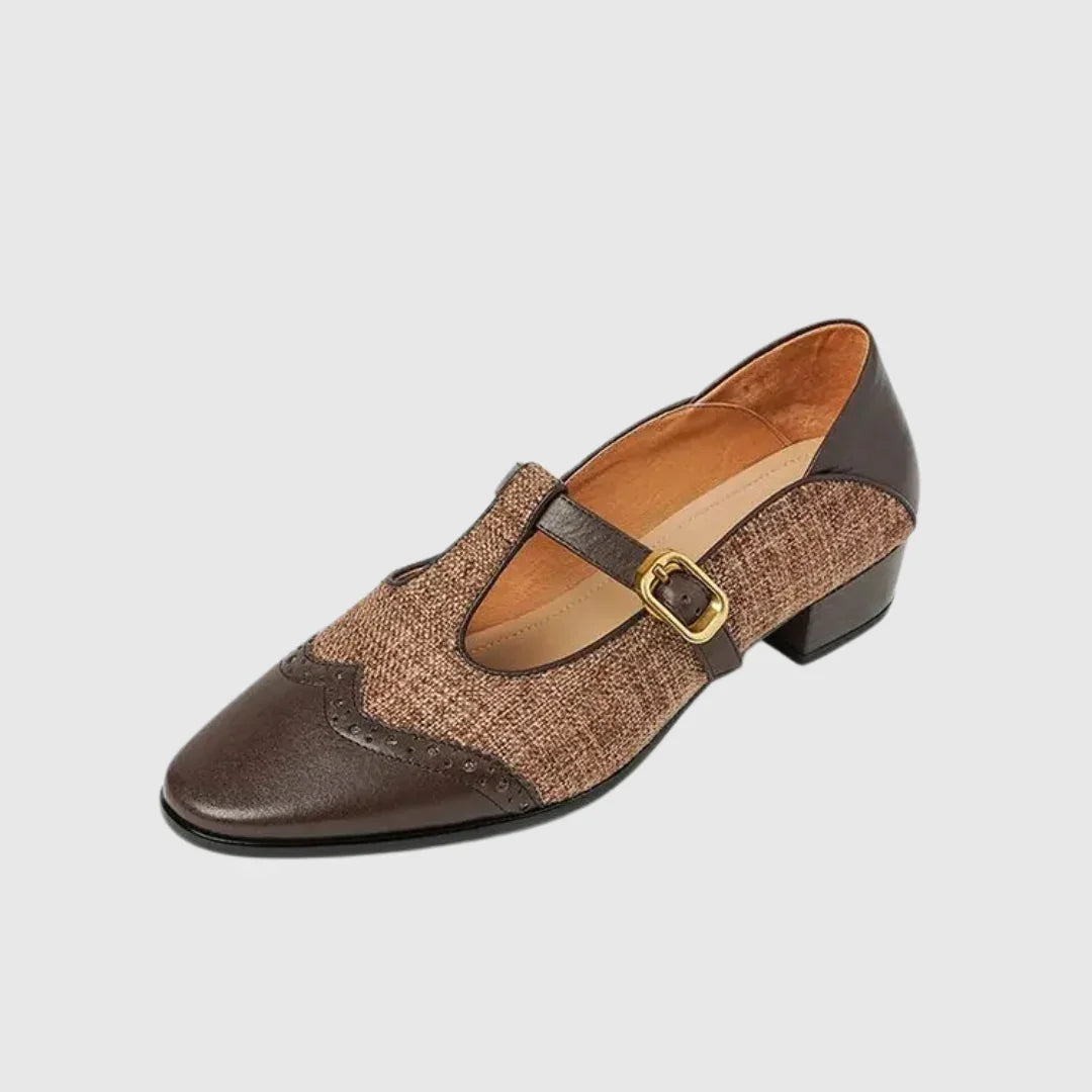 Two-tone leather dress shoe with instep buckle strap and low block heel