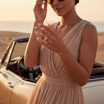 Infinity ring with sparkling stones on rose gold band, seen while wearing