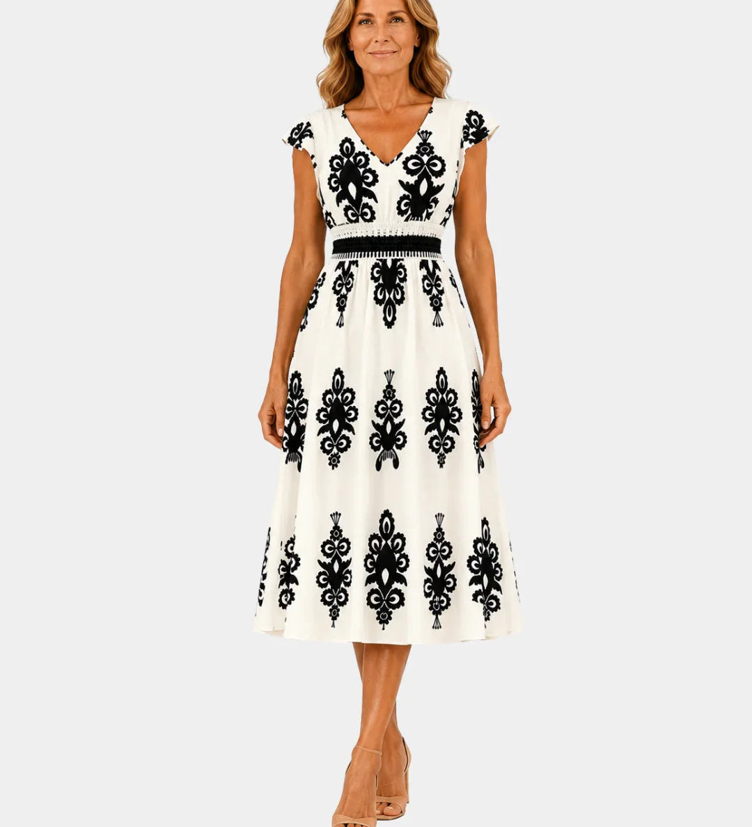 Cream baroque-inspired midi dress with black ornate embroidery, V-neck, cap sleeves, belt