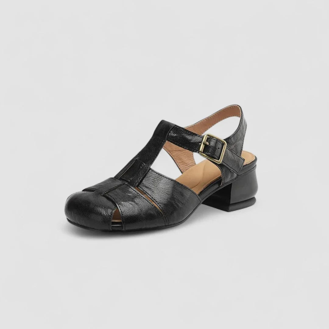 Black leather Mary Jane orthopedic shoes with wide strap and square-toe block heel.