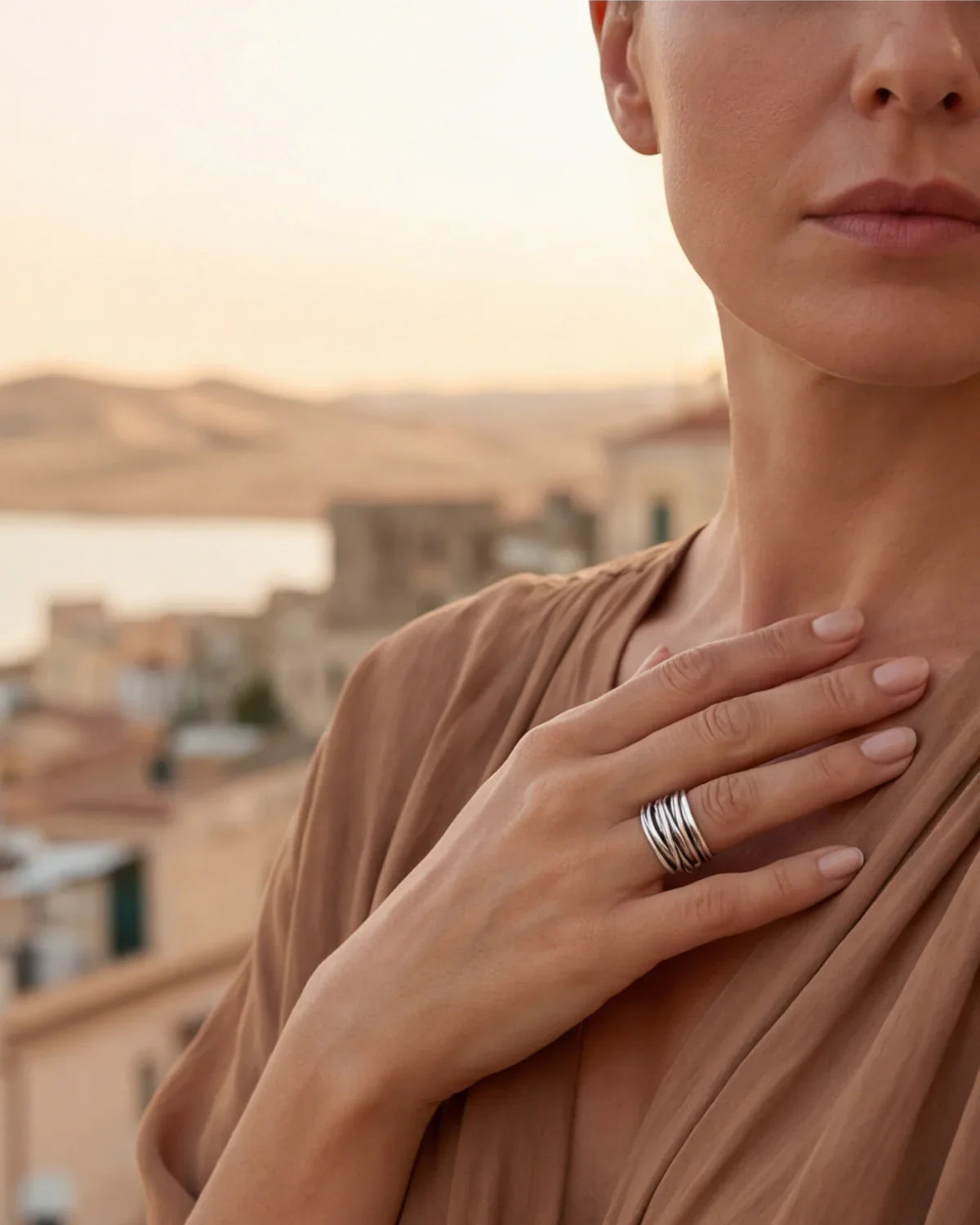 Silver ridged adjustable stack ring on finger