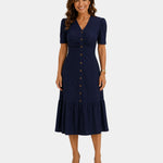 Lightweight shirt dress in navy, short sleeves, button front, gathered tiered skirt hem.