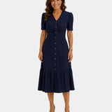 Lightweight shirt dress in navy, short sleeves, button front, gathered tiered skirt hem.