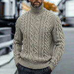 Khaki cable knit turtleneck sweater with twisted braided pattern, ribbed cuffs and hem.