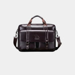 Dark brown leather briefcase with top handle, shoulder strap, and front flap organizer