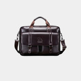 Dark brown leather briefcase with top handle, shoulder strap, and front flap organizer