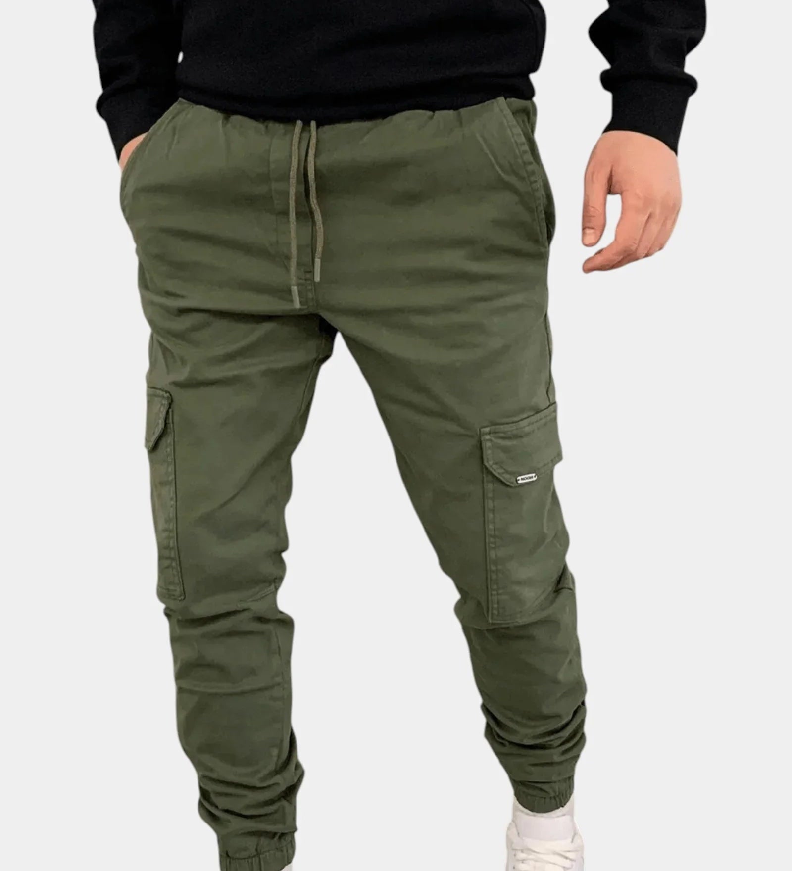 Olive green cargo jogger pants with drawstring waist, side cargo pockets, elastic cuffs.