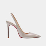 Shiny pale beige pointed-toe slingback heels with high stiletto heel and open back