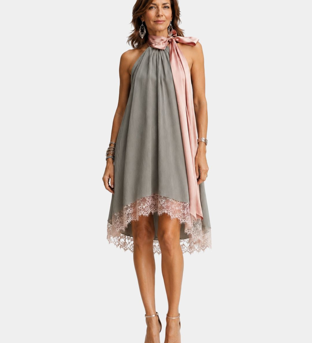 Gray sleeveless halter dress with lace hem and pink draped tie at neckline