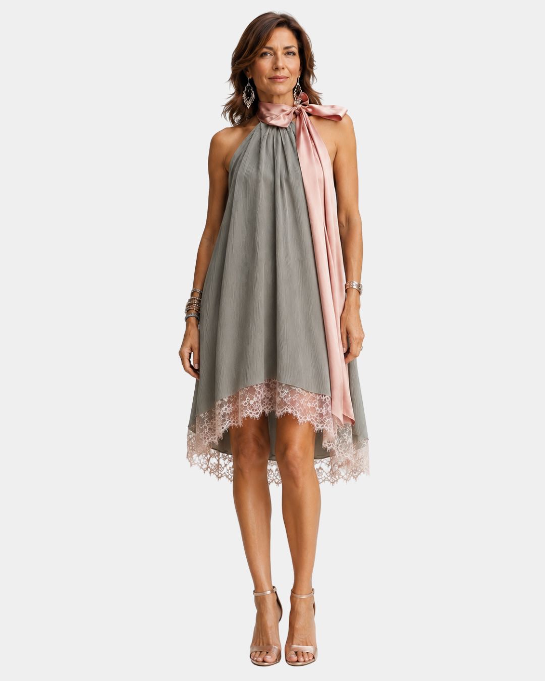 Gray sleeveless halter dress with lace hem and pink draped tie at neckline
