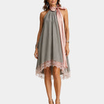 Gray sleeveless halter dress with lace hem and pink draped tie at neckline