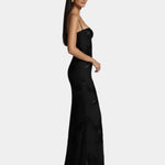 Black floor-length spaghetti-strap gown with subtle floral pattern