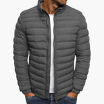 Gray puffer down jacket with full zip front and stand collar.