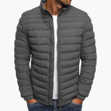Gray puffer down jacket with full zip front and stand collar.