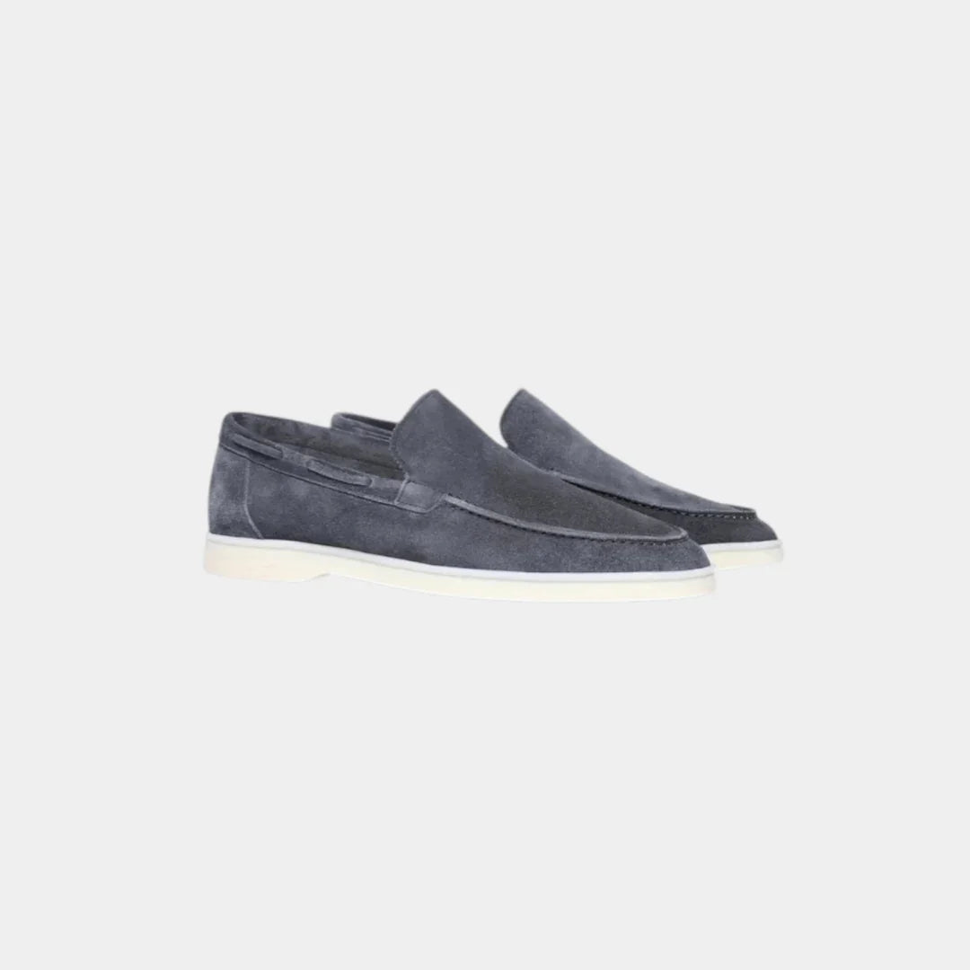 Dark blue suede loafers with moc toe and white rubber sole
