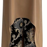 Taupe sleeveless tunic featuring a curved hem over black gold paisley wide-leg pants