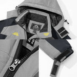 Gray winter jacket hood with black faux-fur lining, front zipper and reflective patches