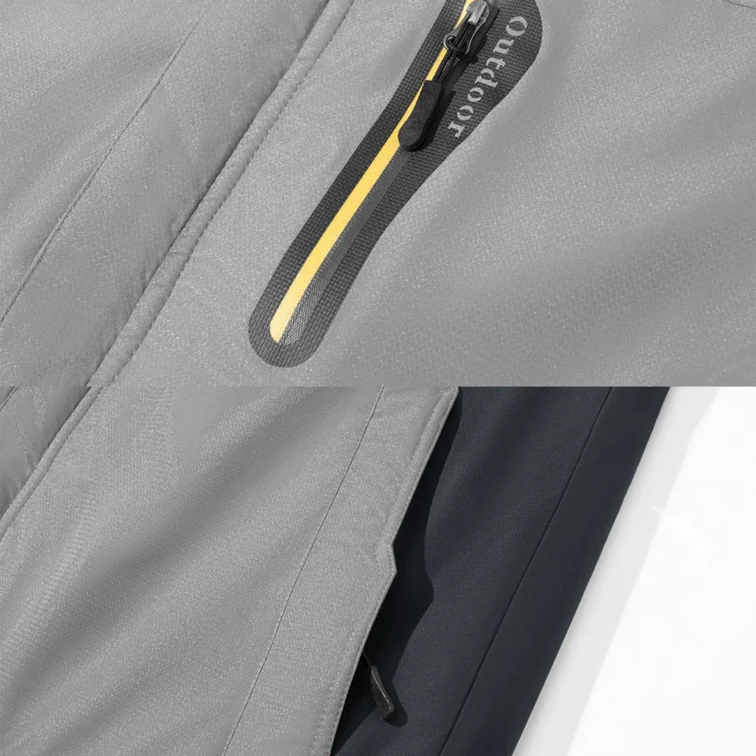 Gray winter jacket fabric close-up with yellow-trim zip and curved pocket panel