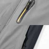 Gray winter jacket fabric close-up with yellow-trim zip and curved pocket panel