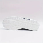 White sneaker outsole with deep tread for traction