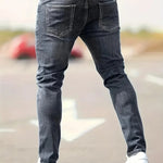 Dark gray ripped slim-fit jeans with five-pocket denim and distressed knee rips