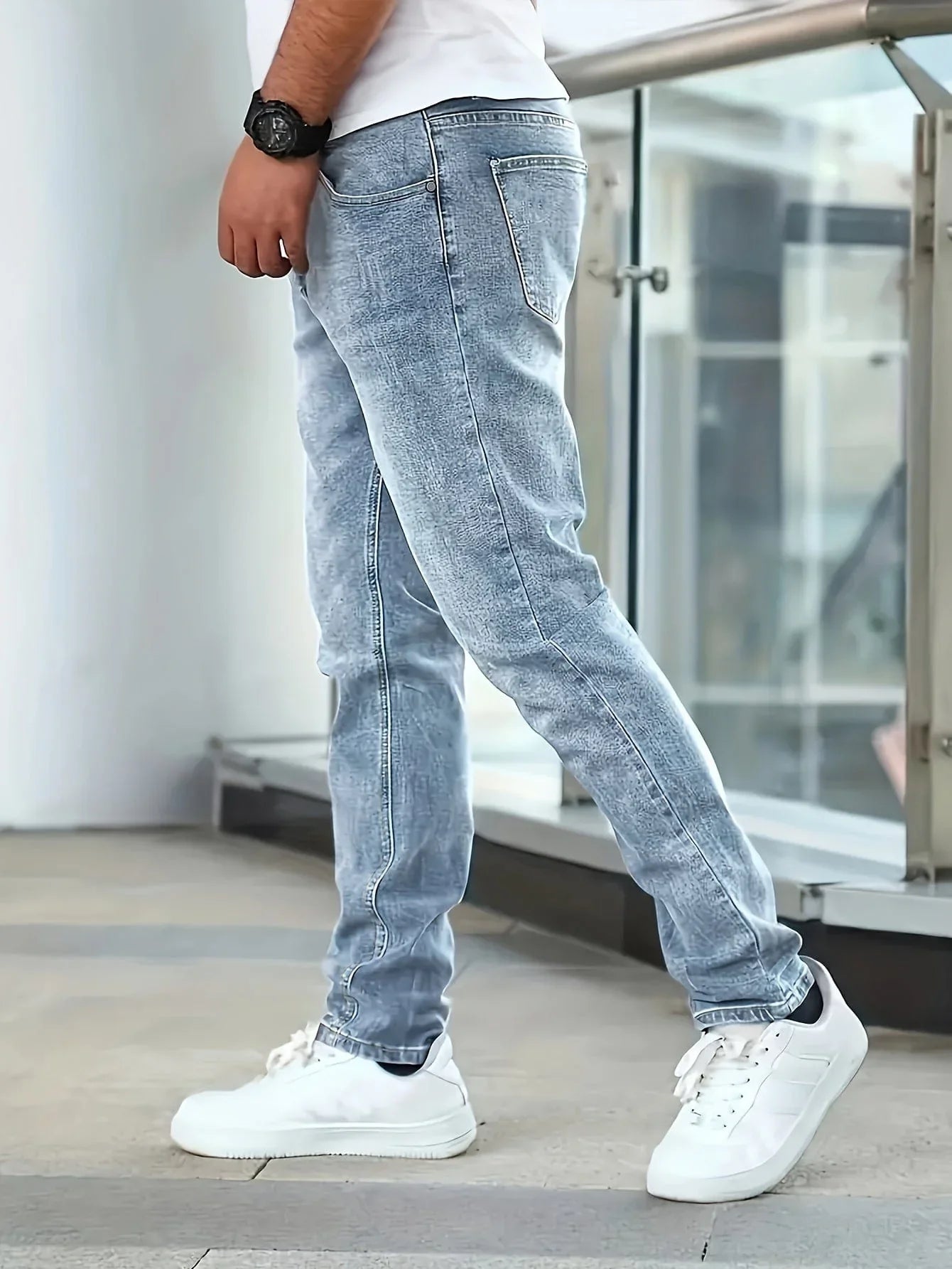 Light blue casual stretch jeans, straight fit, zip fly and belt loops.