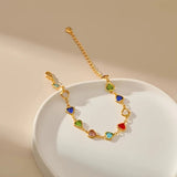 Gold-tone heart charm bracelet with multicolor enamel heart stones
