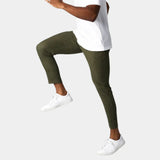 Olive green chino pants with slim tapered fit and button front, ankle length.