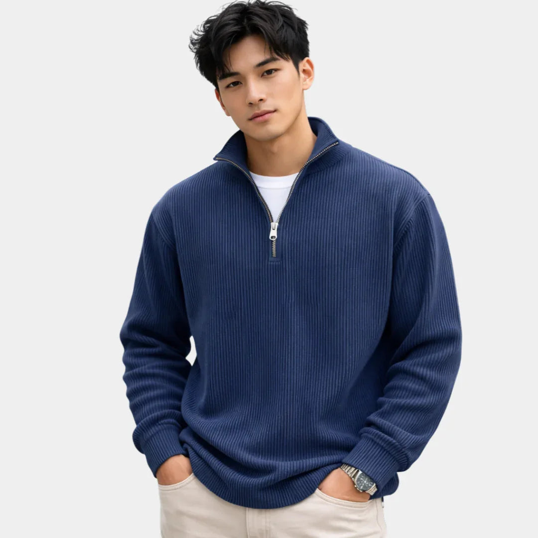 Navy blue ribbed quarter-zip sweater with long sleeves and metal zipper placket
