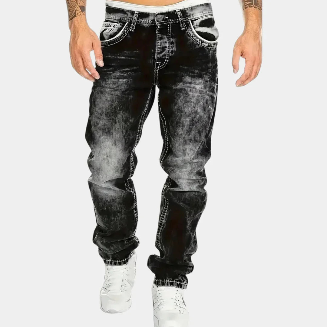 Black stretch jeans with five-pocket styling, tapered fit, and cuffed ankle hem