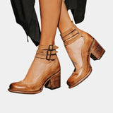 Brown ankle-strap block heel shoes with two buckled straps, chunky heel, pointed toe