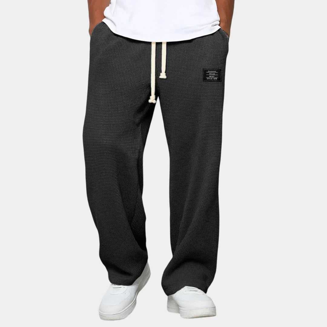 Men's drawstring pants, relaxed fit, textured black fabric