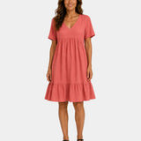 Light red textured V-neck midi dress with short sleeves and tiered skirt