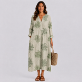 Light sage green summer dress with white floral print, V-neck, long sleeves