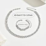 Silver fish tail link necklace with matching bracelet pieces, laid flat for sizing