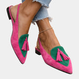 Pink suede heeled sandals with green panel, tassel fringe, and black heel