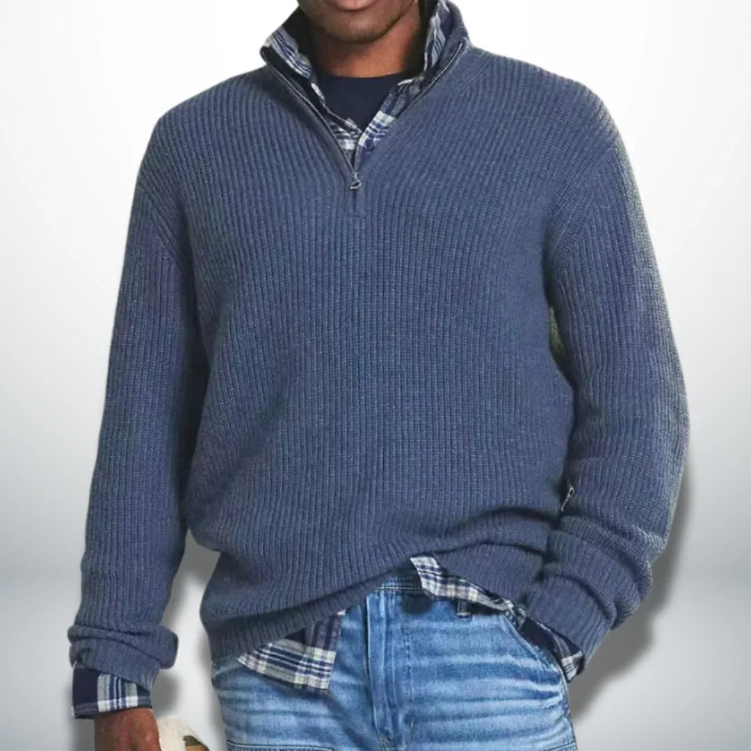 Blue knit quarter-zip sweater with ribbed cuffs and hem.