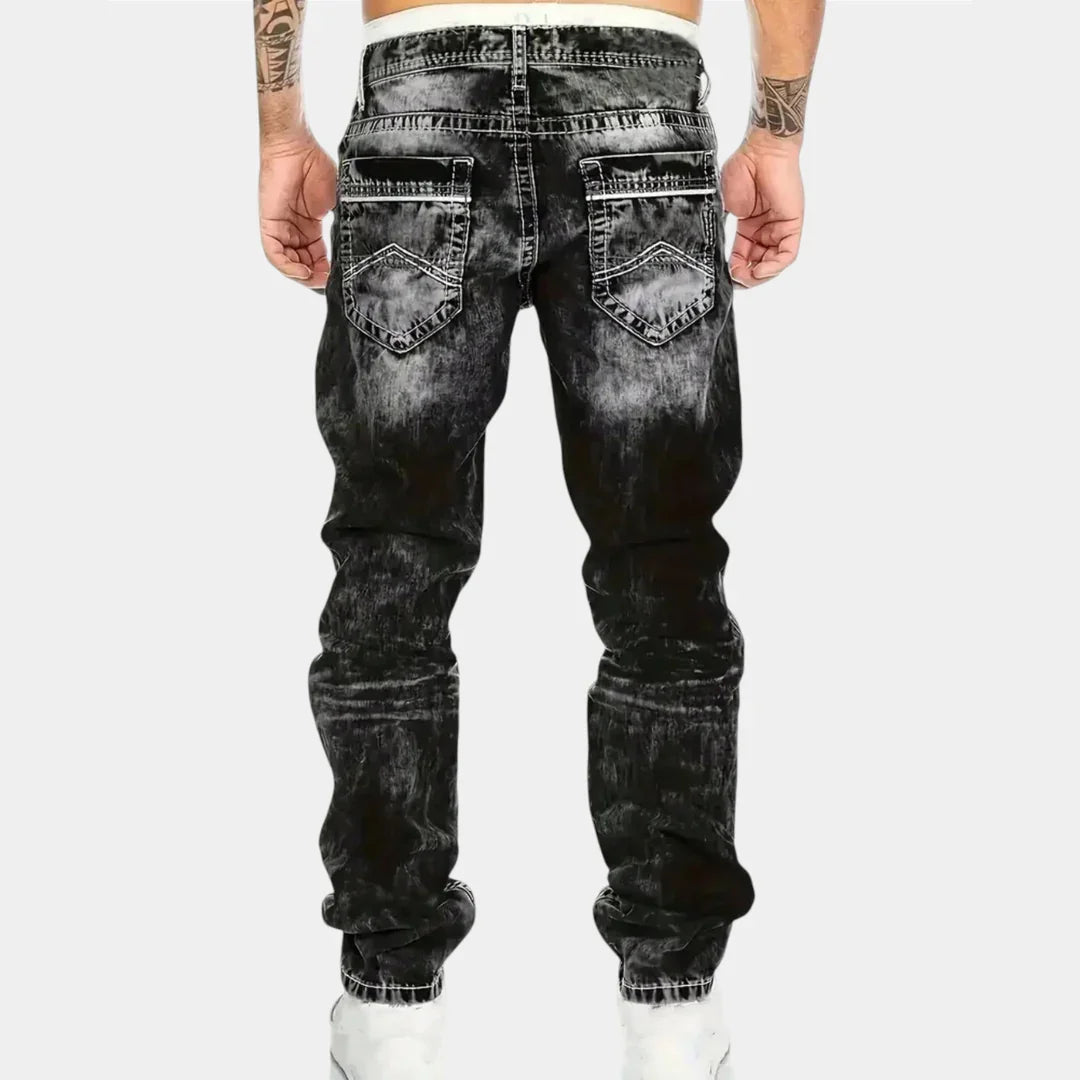 Black stretch jeans with belt loops, back patch pockets, and tapered leg openings
