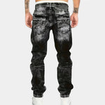Black stretch jeans with belt loops, back patch pockets, and tapered leg openings