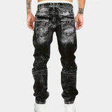Black stretch jeans with belt loops, back patch pockets, and tapered leg openings