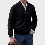 Black half-zip knit sweater with ribbed collar, cuffs, and hem.