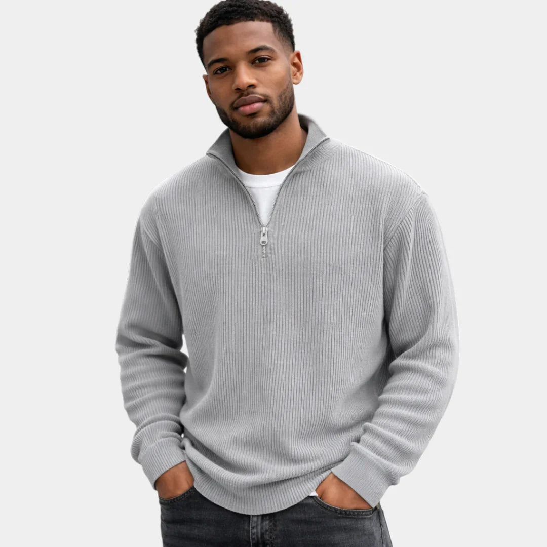 Gray ribbed quarter-zip sweater with long sleeves and metal zip placket