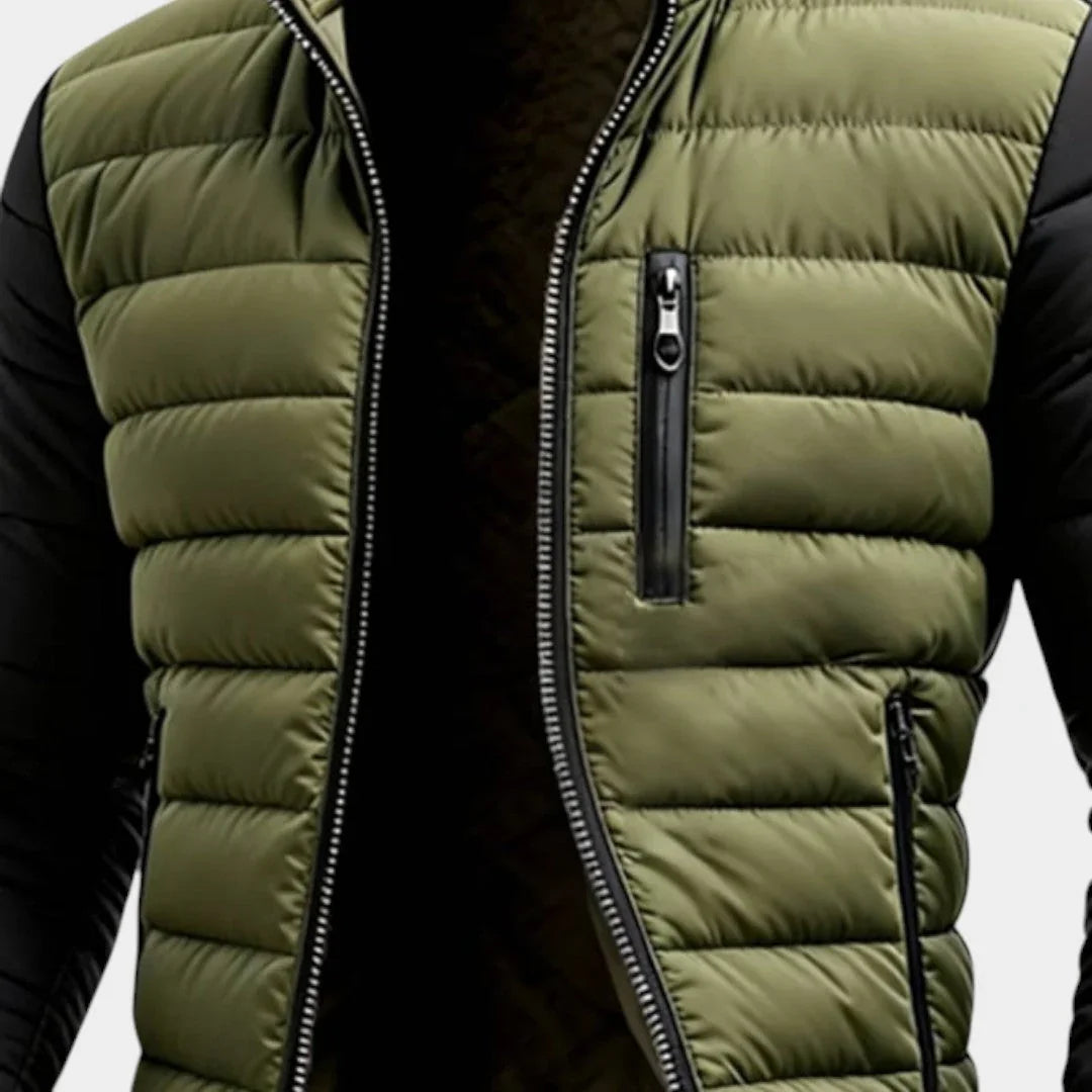 Men's puffer jacket chest close-up: green quilted body, zip pocket and stand collar