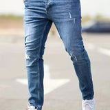 Slim-fit ripped jeans in dark blue wash, distressed knees and slim tapered legs