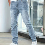 Light blue casual stretch jeans with tapered straight legs and five-pocket layout