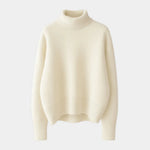 Cream soft turtleneck sweater with ribbed collar, long sleeves, and knitted hem.