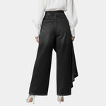 High-waisted wide-leg jeans in black, back view with angled draped side hem